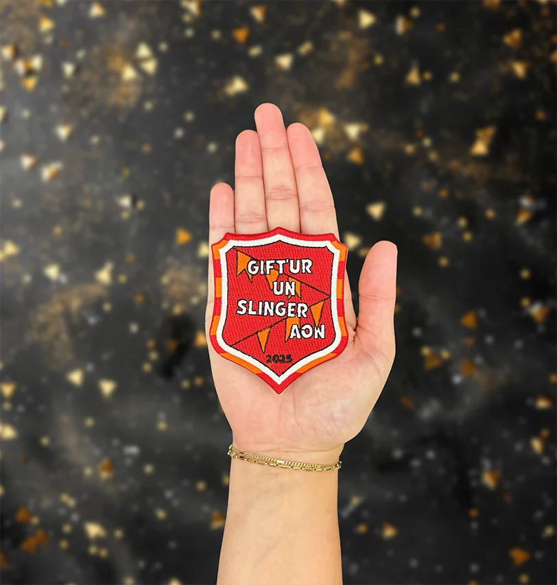 Gift'ur un slinger aon - Motto 2025 - Kielegatcarnavalmotto - IN010-12